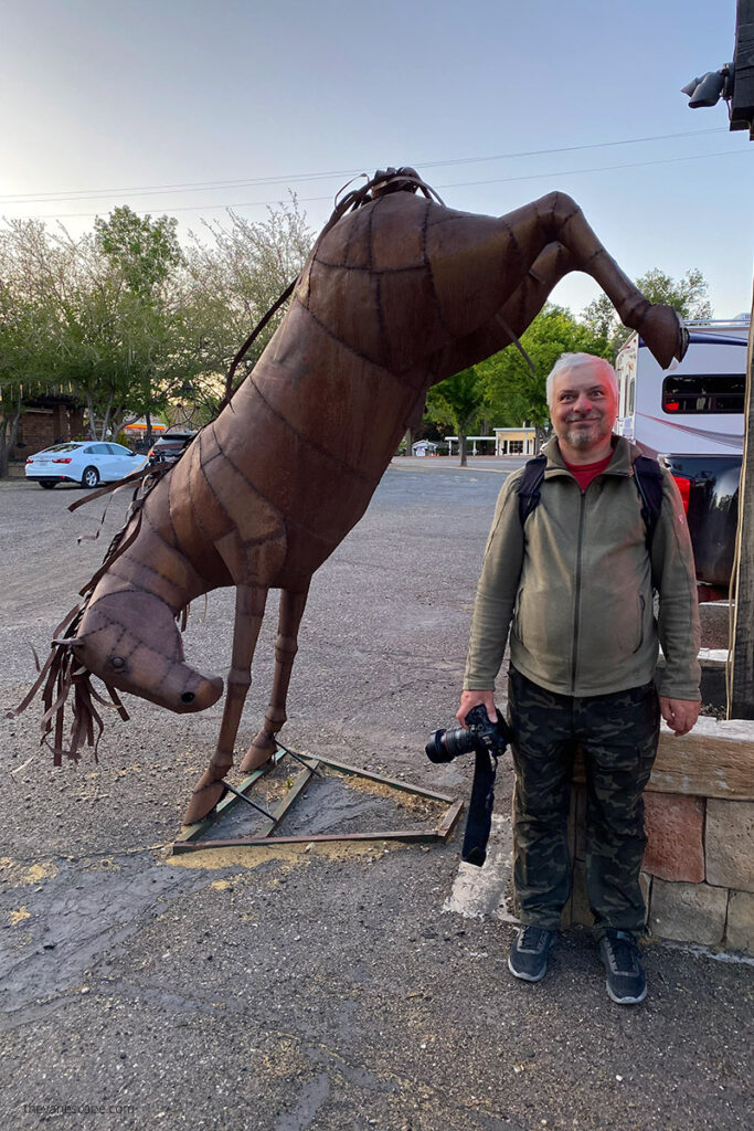 Chris with metal horse sculpture in Kanab, Utah.