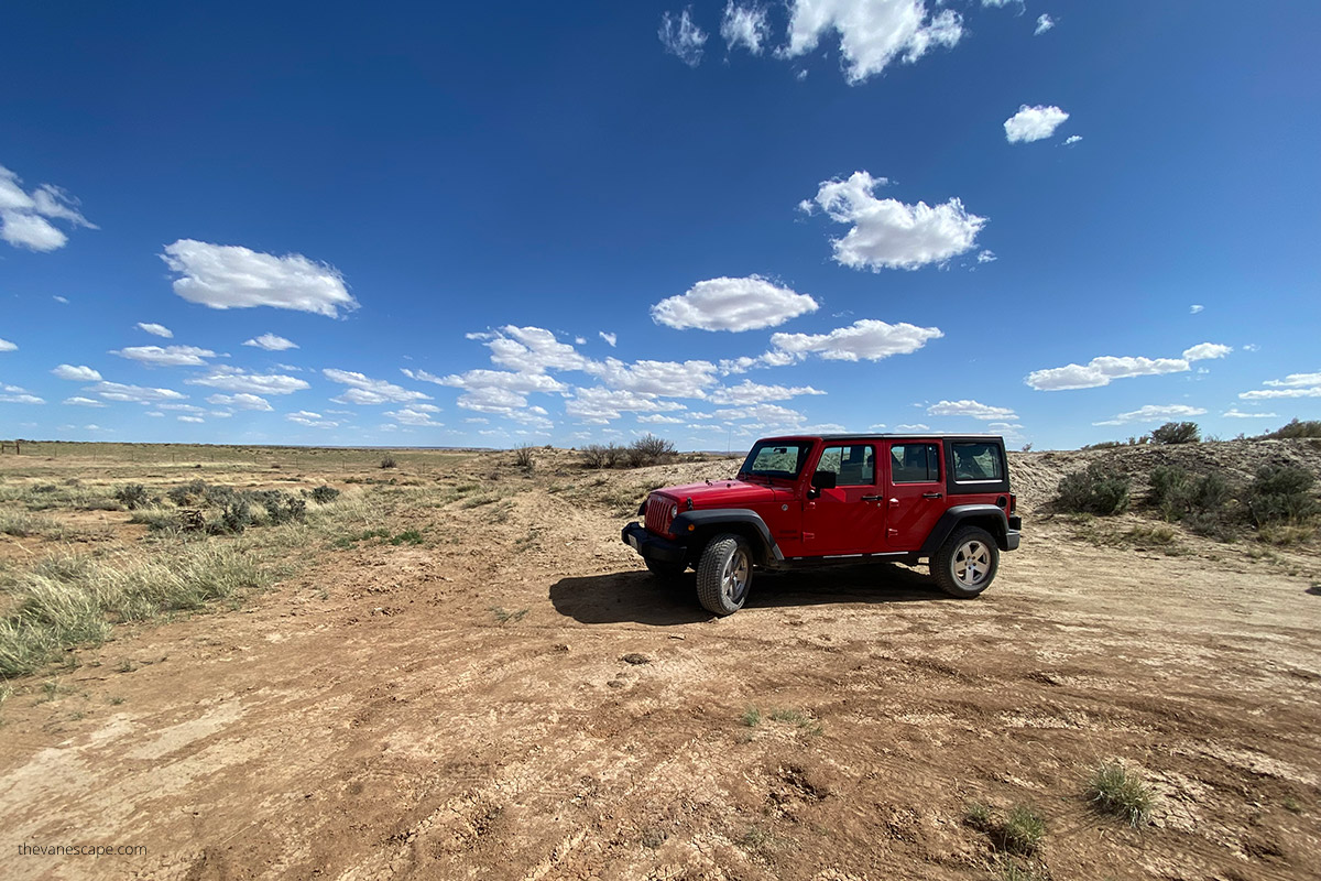 our red jeep wrangler on a desert