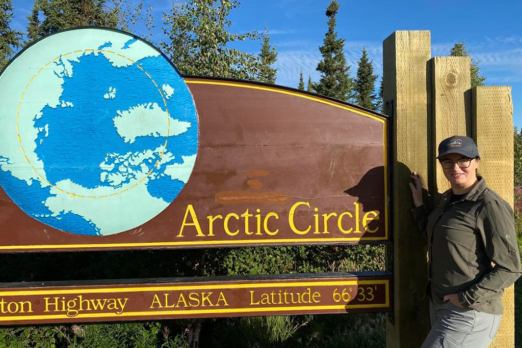 Agnes crossing the Arctic Circle during tour from Fairbanks in summer