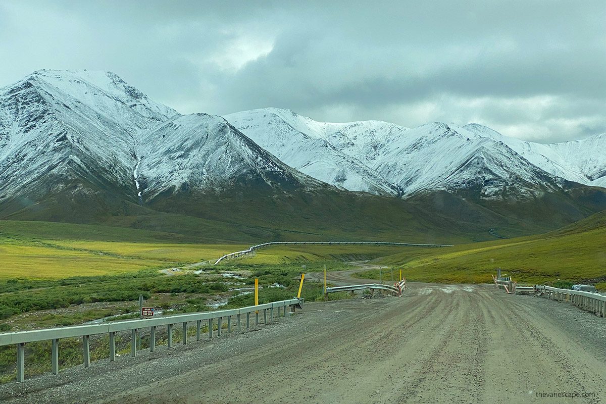 gravel surface of dalton highway and mountain view