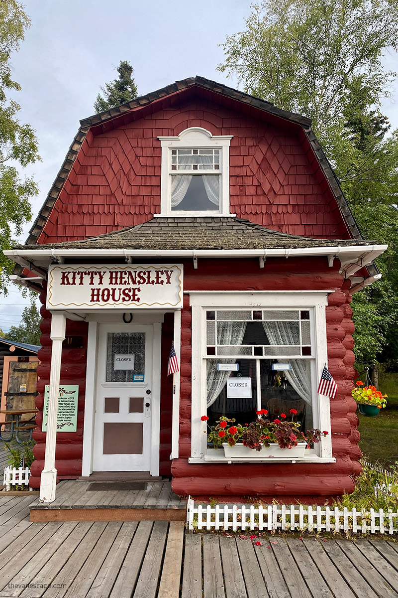 historical maroon wooden Kitty Hensley House in Pioneer Park in Fairbanks