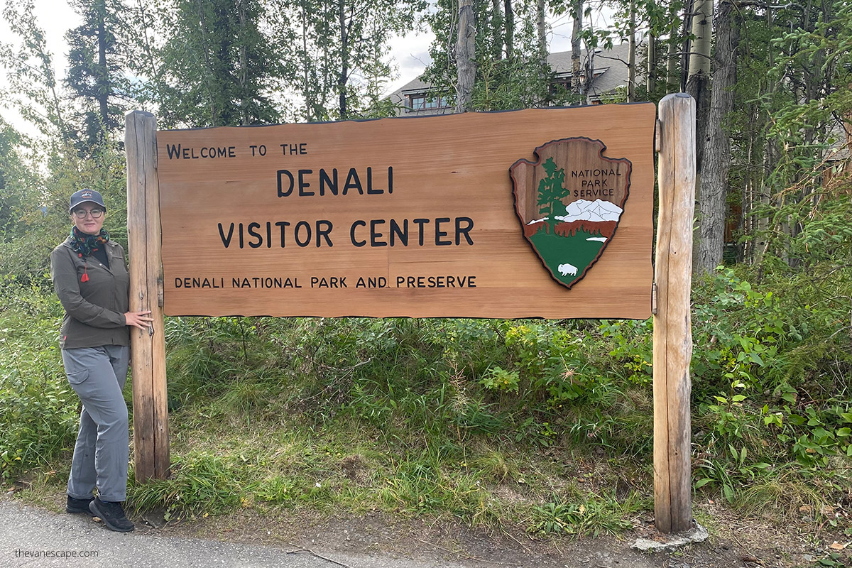 Agnes with welcome to Denali Vistor Center sign