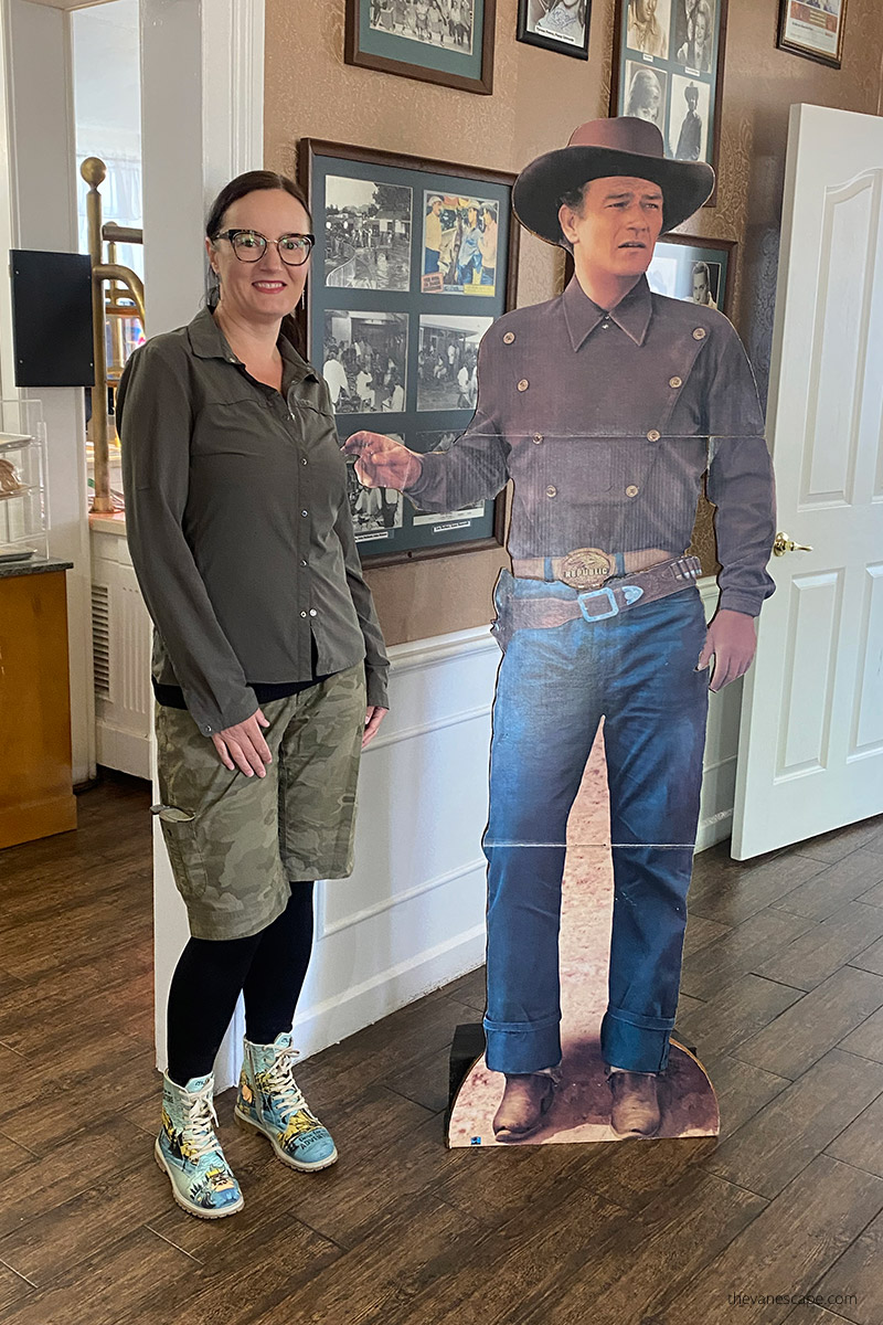 Agnes in Parry Lodge with John Wayne poster
