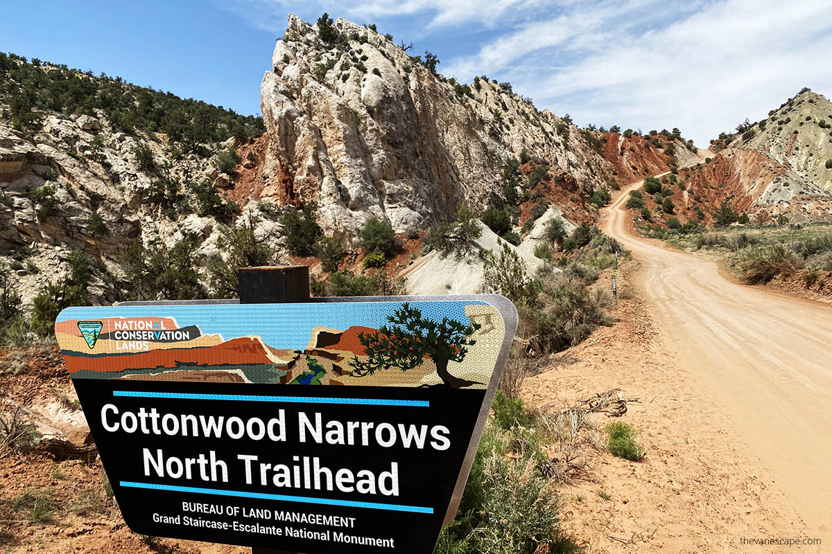 cottonwood narrows north trailhead sign with mountain and road backdrop