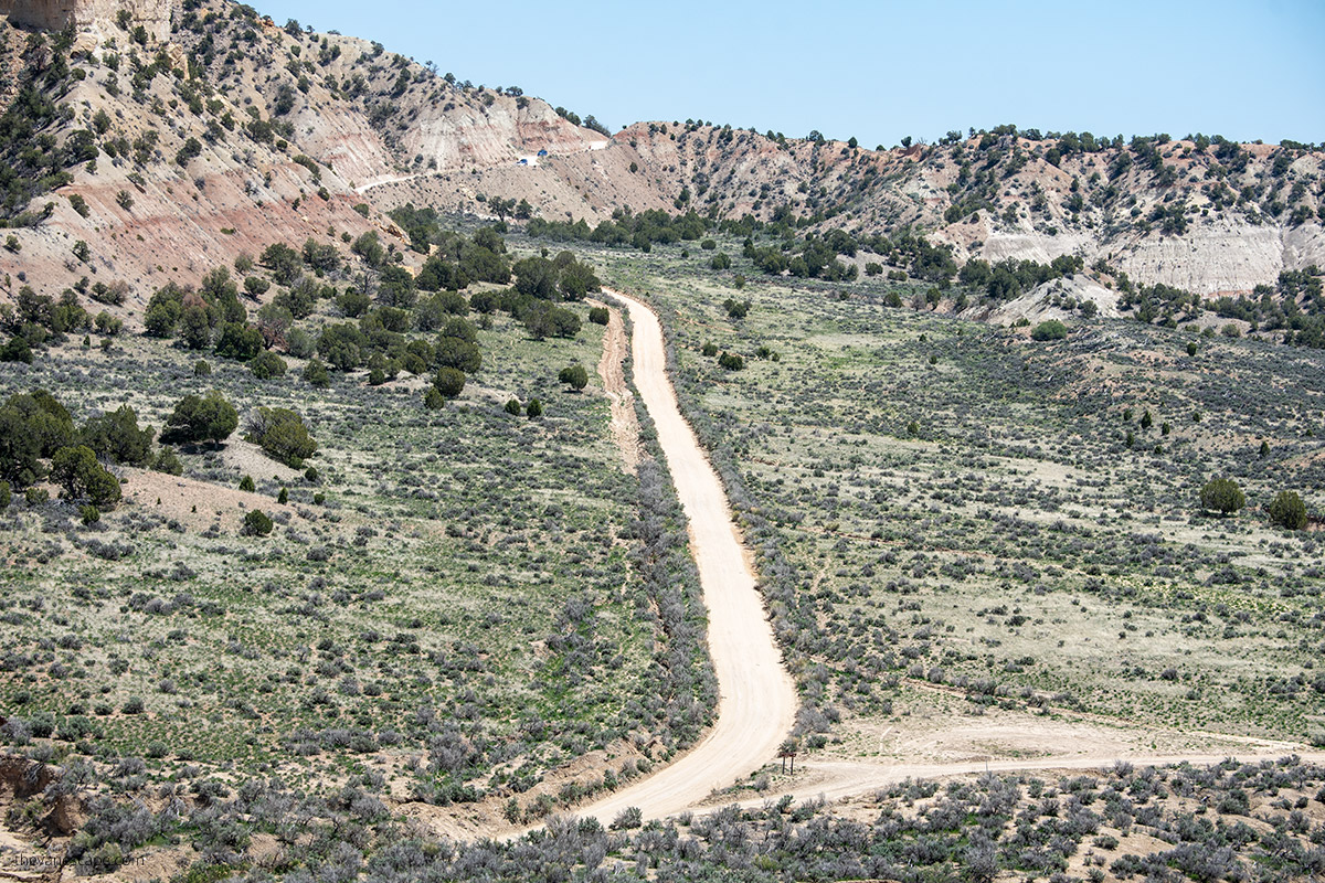 driving the scenic road with mountain backdrop