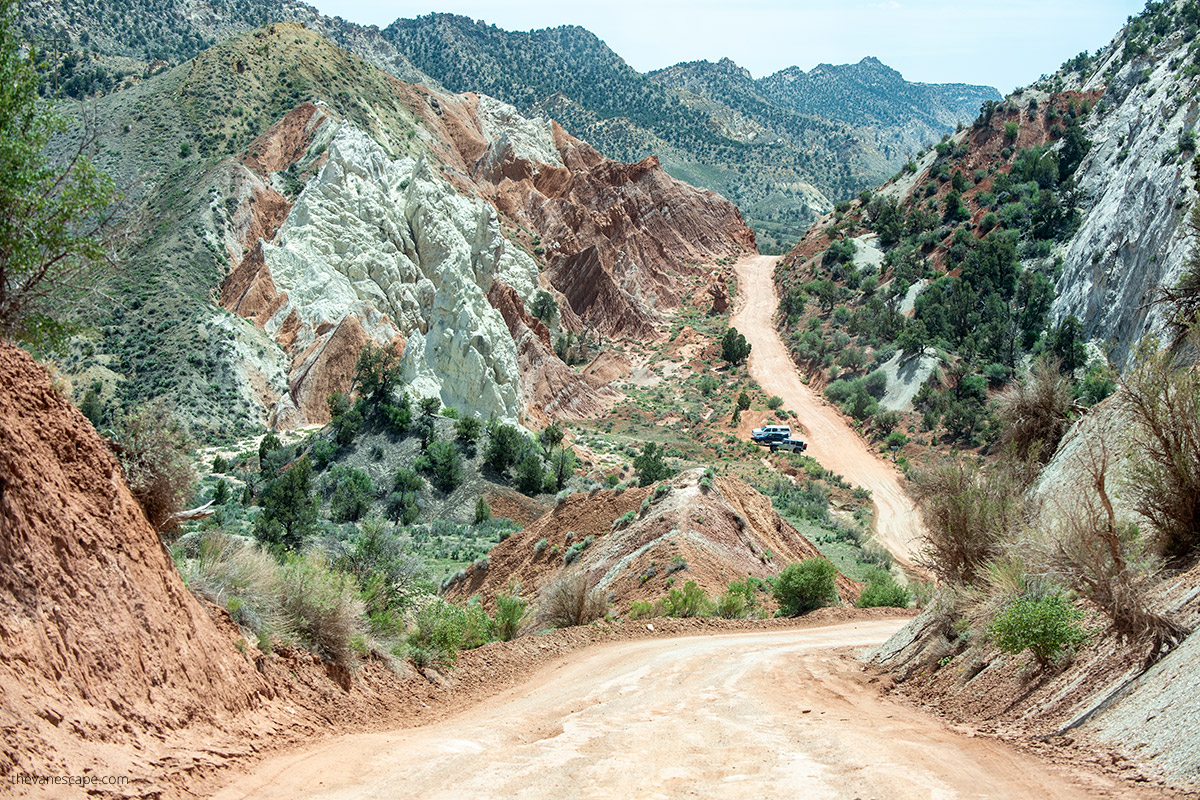 paved road with mountain backdrop