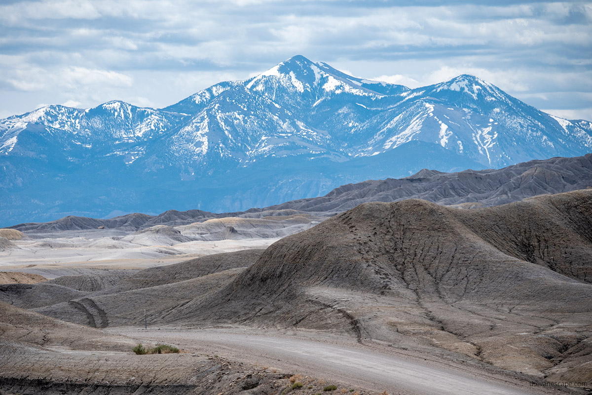 mountain view with snowy peaks - the view from the undulating Factory Butte Recreation Area