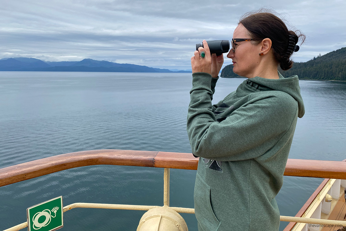 Agnes using binoculars on ship - must have items during alaska cruise