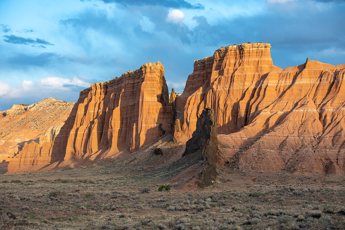 huge orange rock formations during sunset