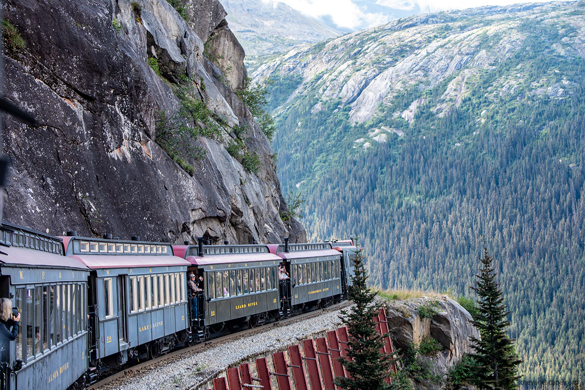 scenic train ride in skagway alaska - mountain view and train