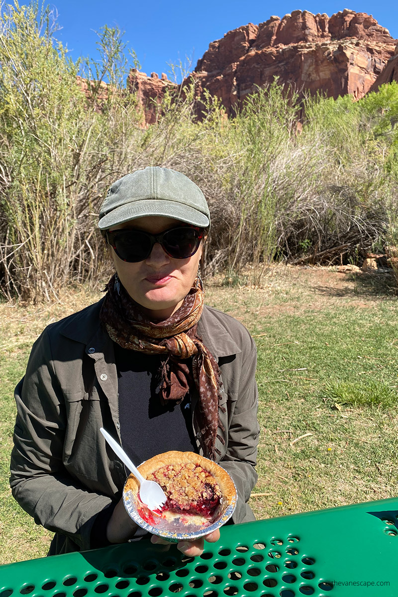 Agnes Stabinska, the author, is eating fruits pie in Gifford Homestead - must see place during one day trip to Capitol Reef.