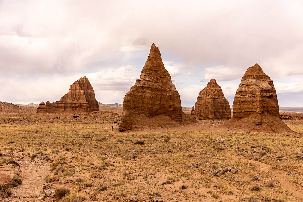 huge and orange temple of the moon and temple of the sun in capitol reef national park - one of the most remote place and most photogenic landmark. 