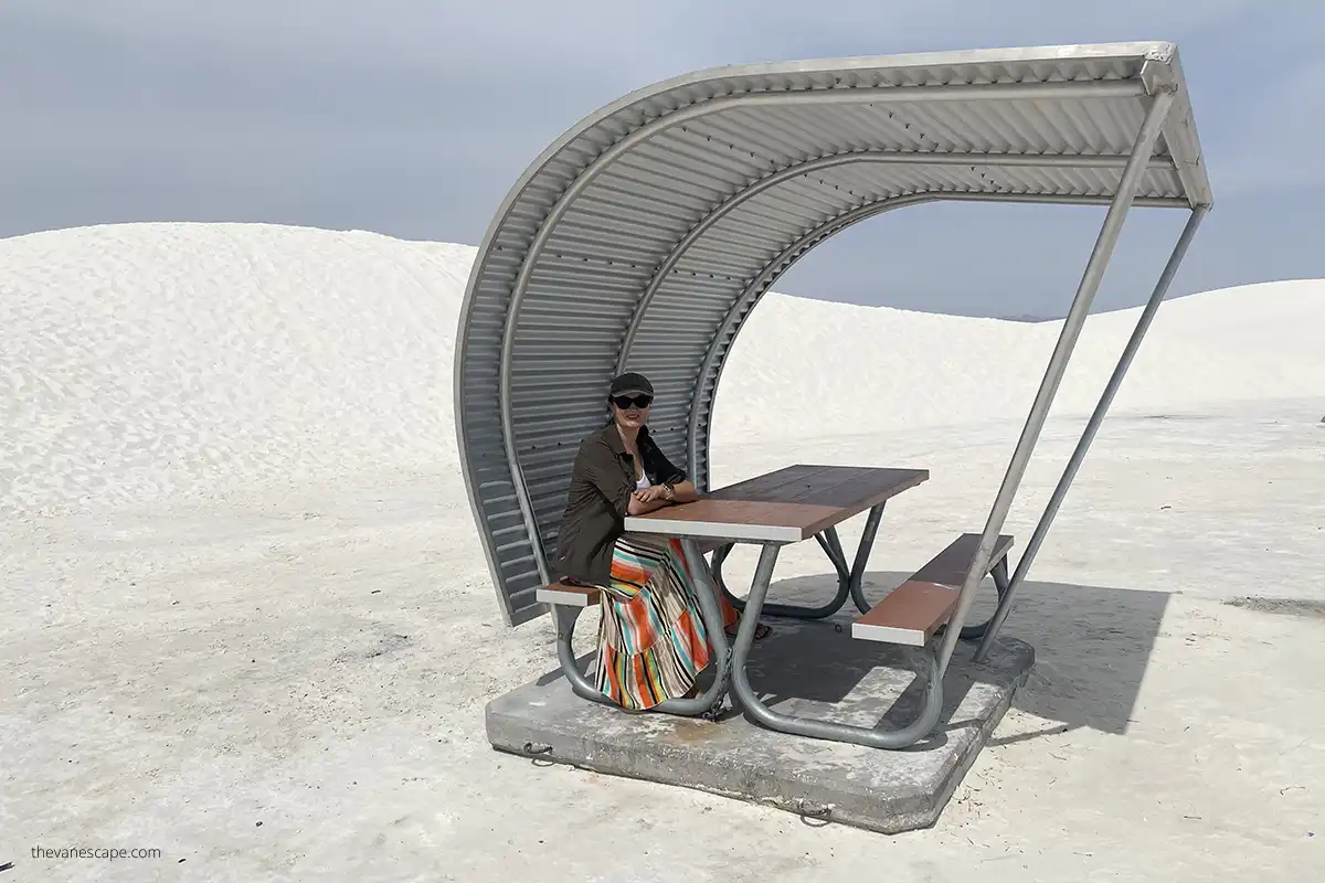 Agnes Stabinska, author, is sitting in a shelter in the picnic area in White Sands National Park. 